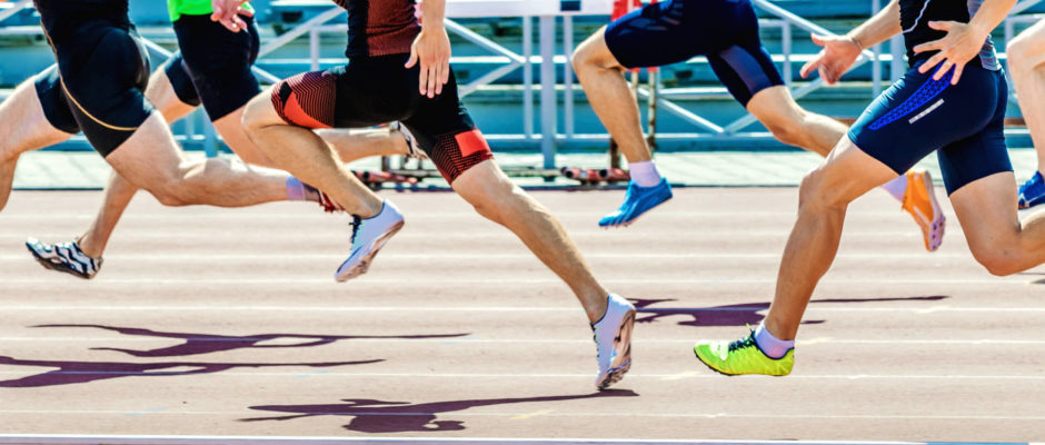 group of athletes sprinters run speed on track of stadium